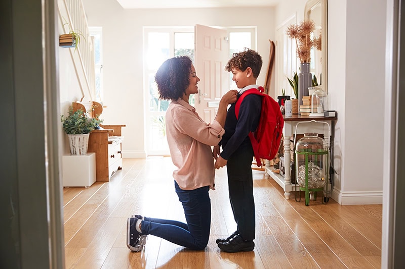 Mother sending her child off to school.
